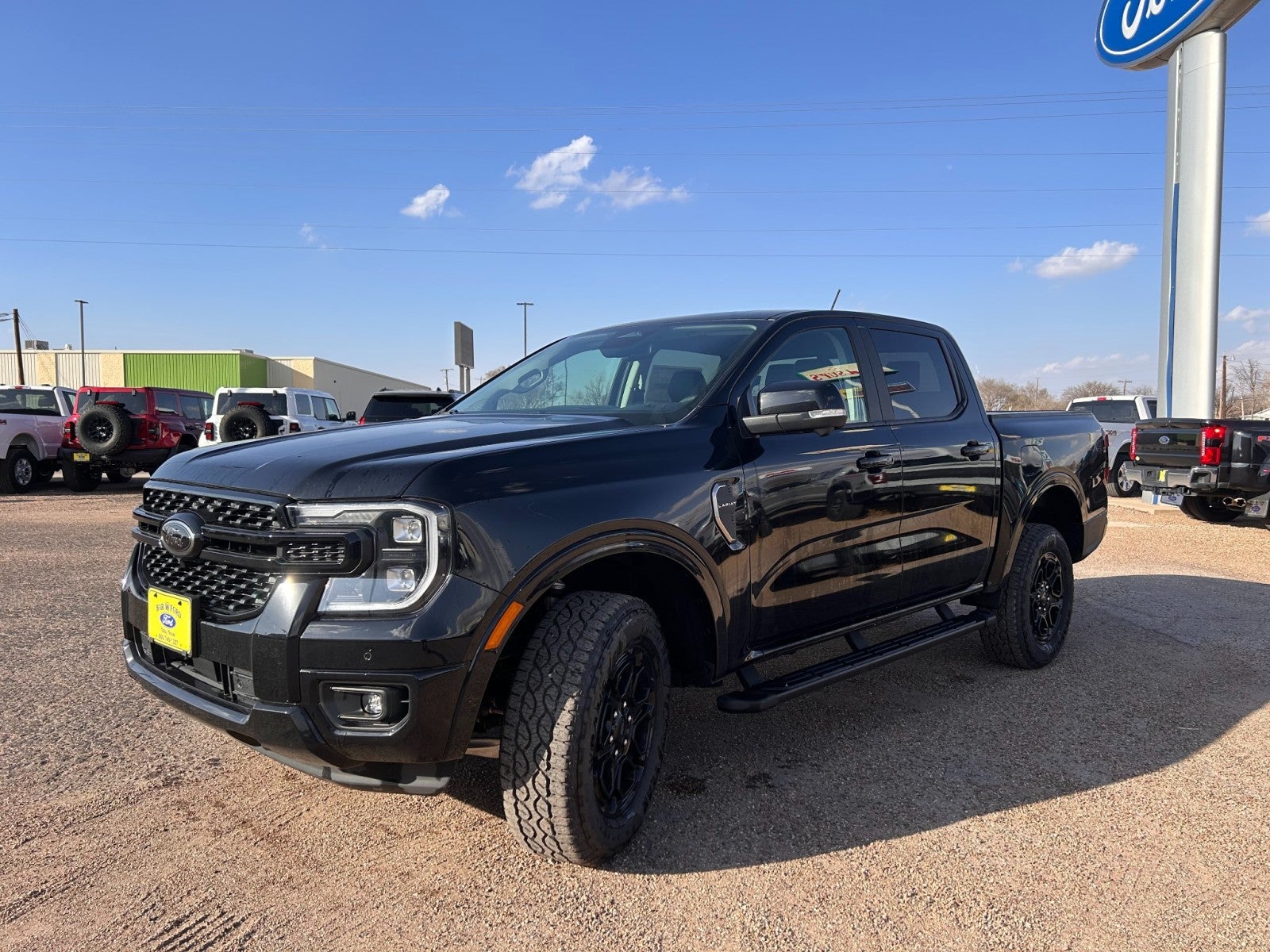2025 Ford Ranger LARIAT in Shadow Black — front three-quarter view