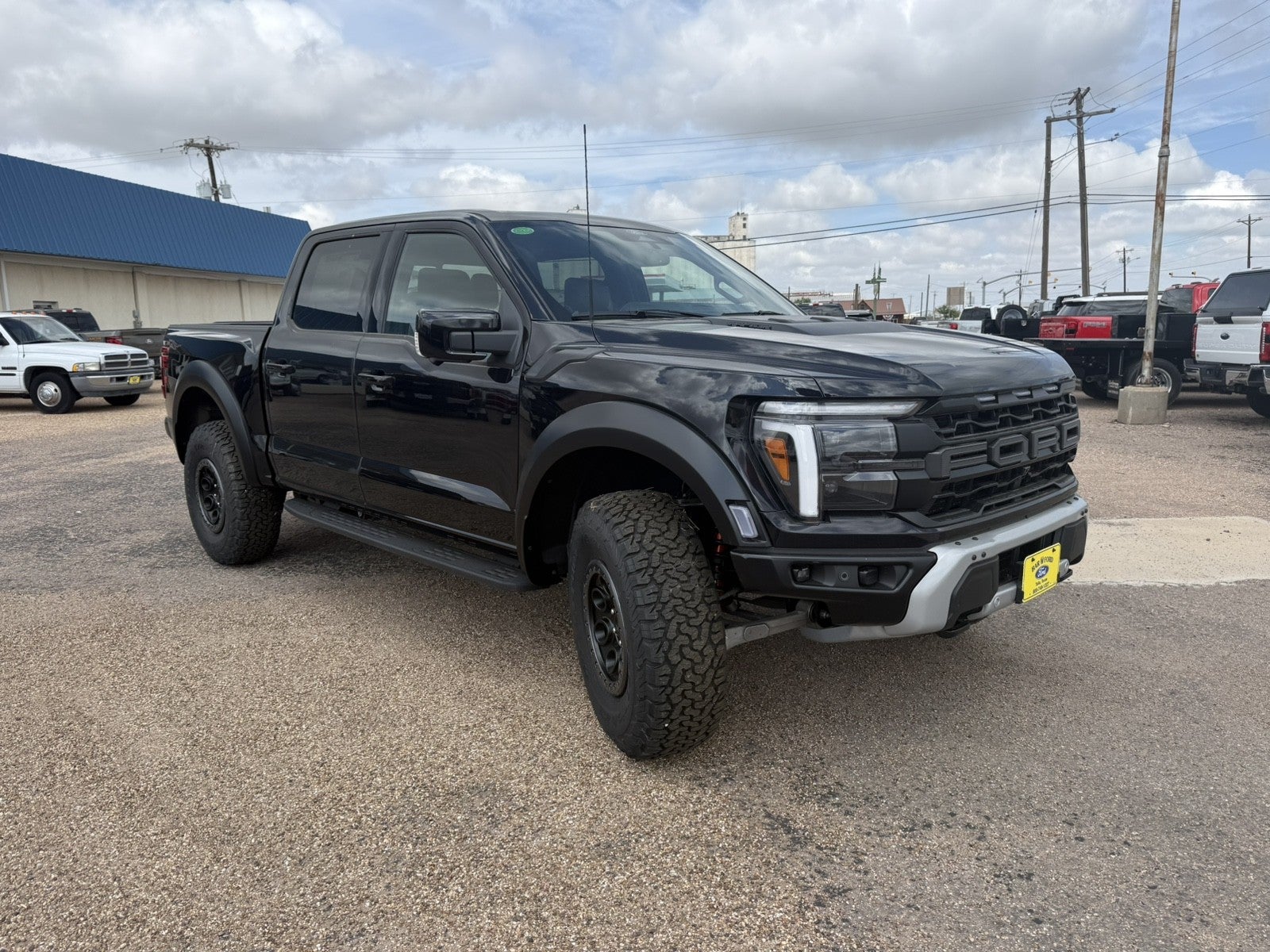 2026 Ford F-150 Raptor in Agate Black Metallic — front three-quarter view