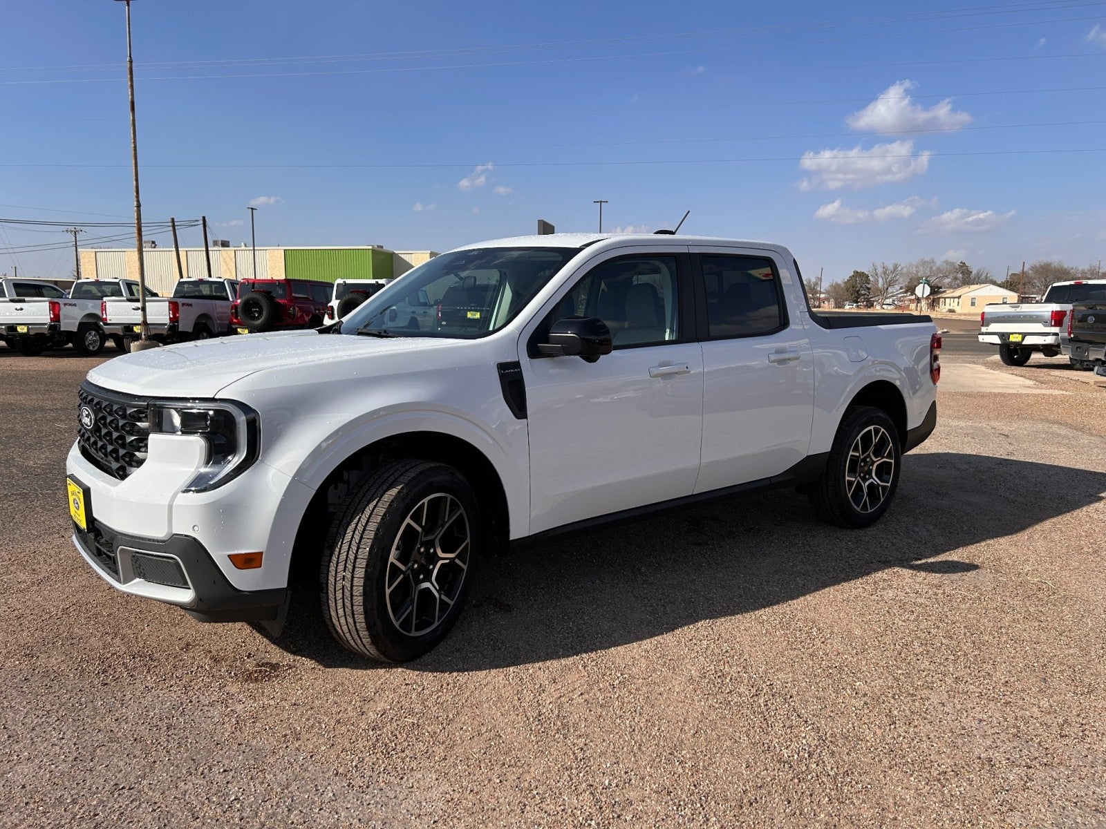 2026 Ford Maverick Lariat in Oxford White — front three-quarter view